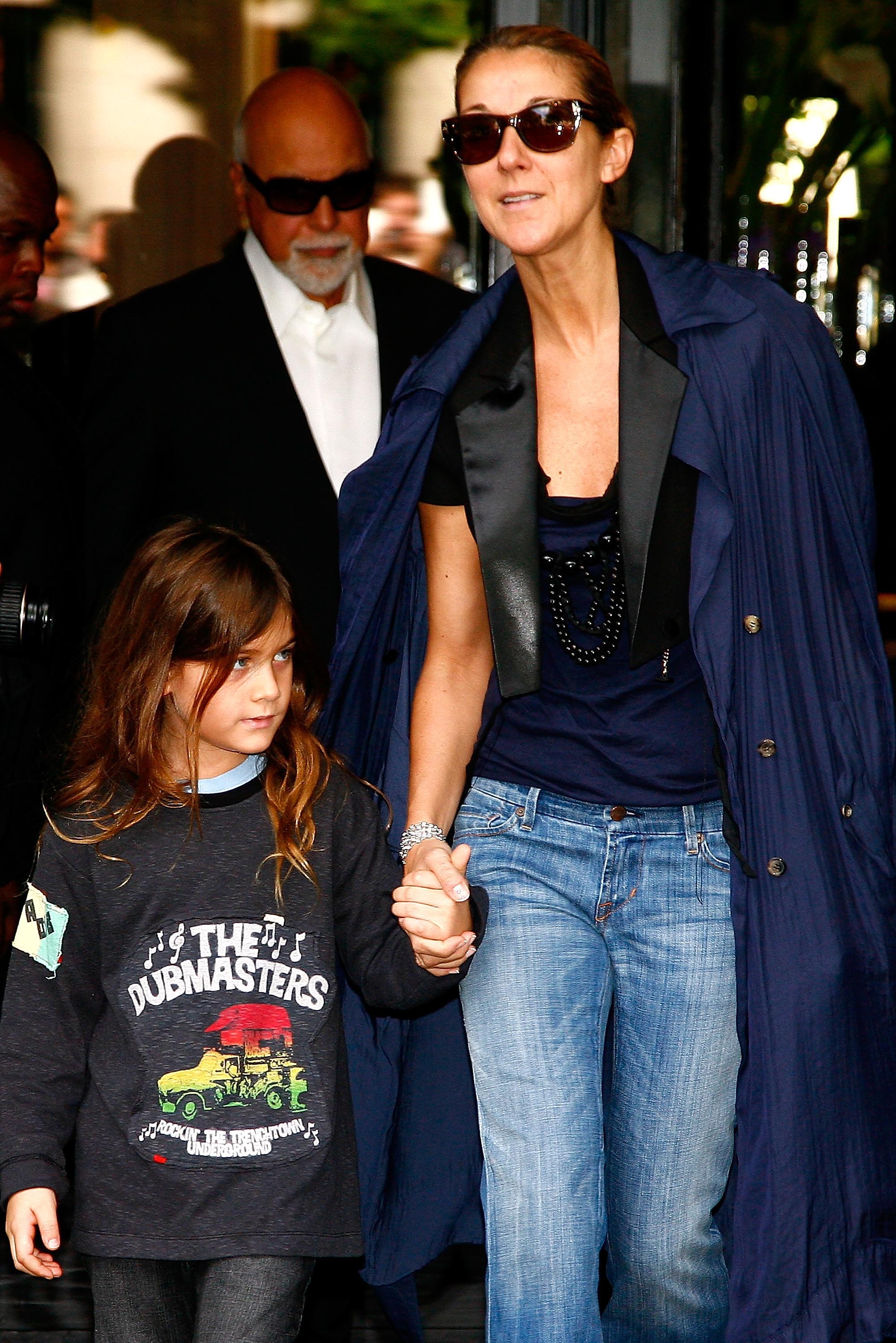 Rene-Charles, Rene Angelil (at the back), and Celine Dion leave the Four Seasons George V hotel on May 20, 2008 in Paris, France. | Source: Getty Images