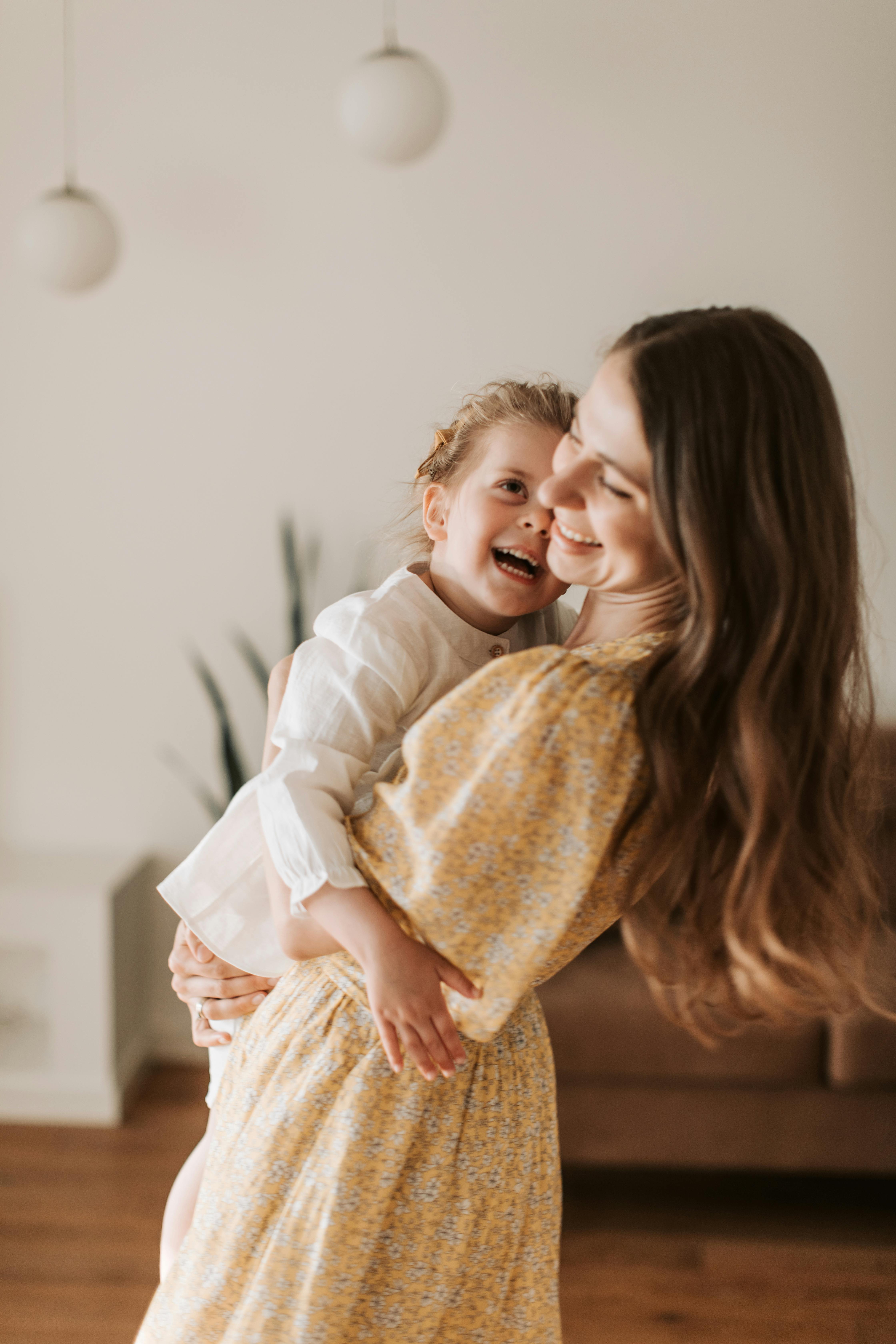 A happy woman and a happy girl | Source: Pexels