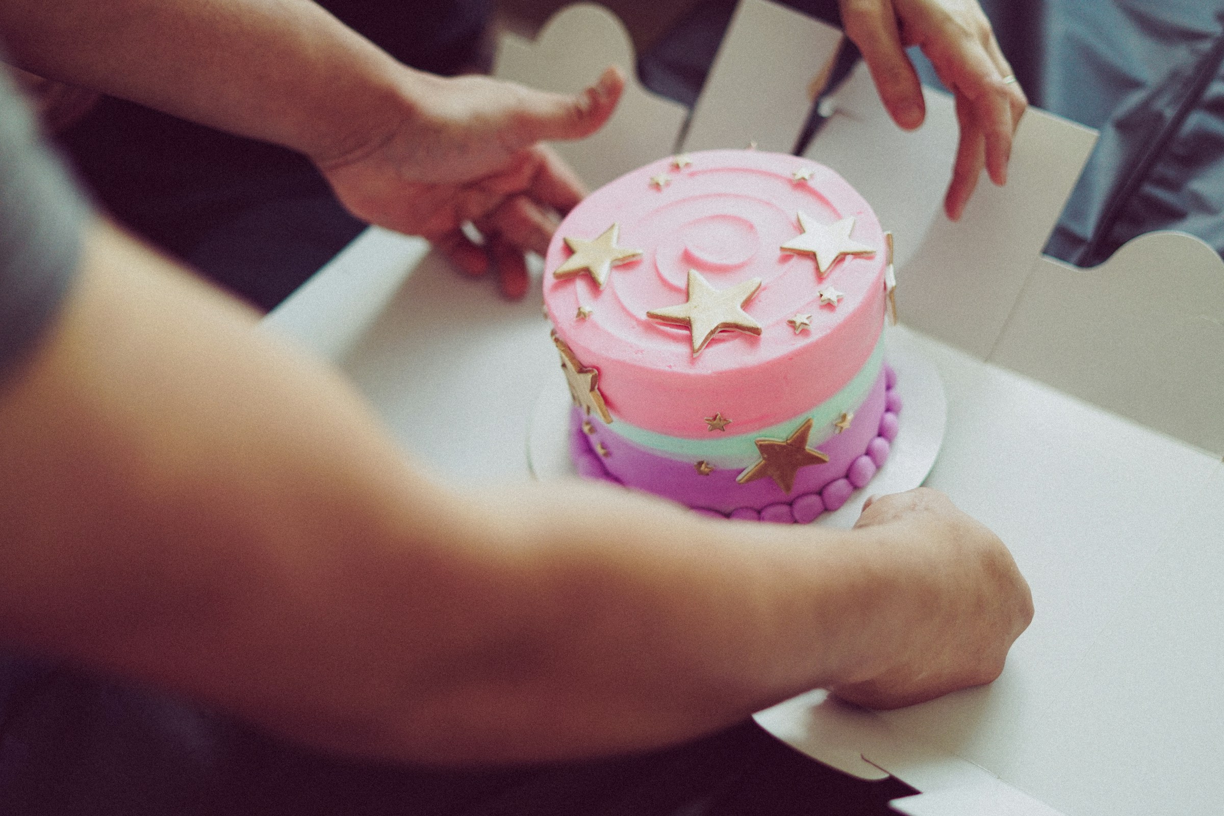 A man opening a cake box | Source: Unsplash