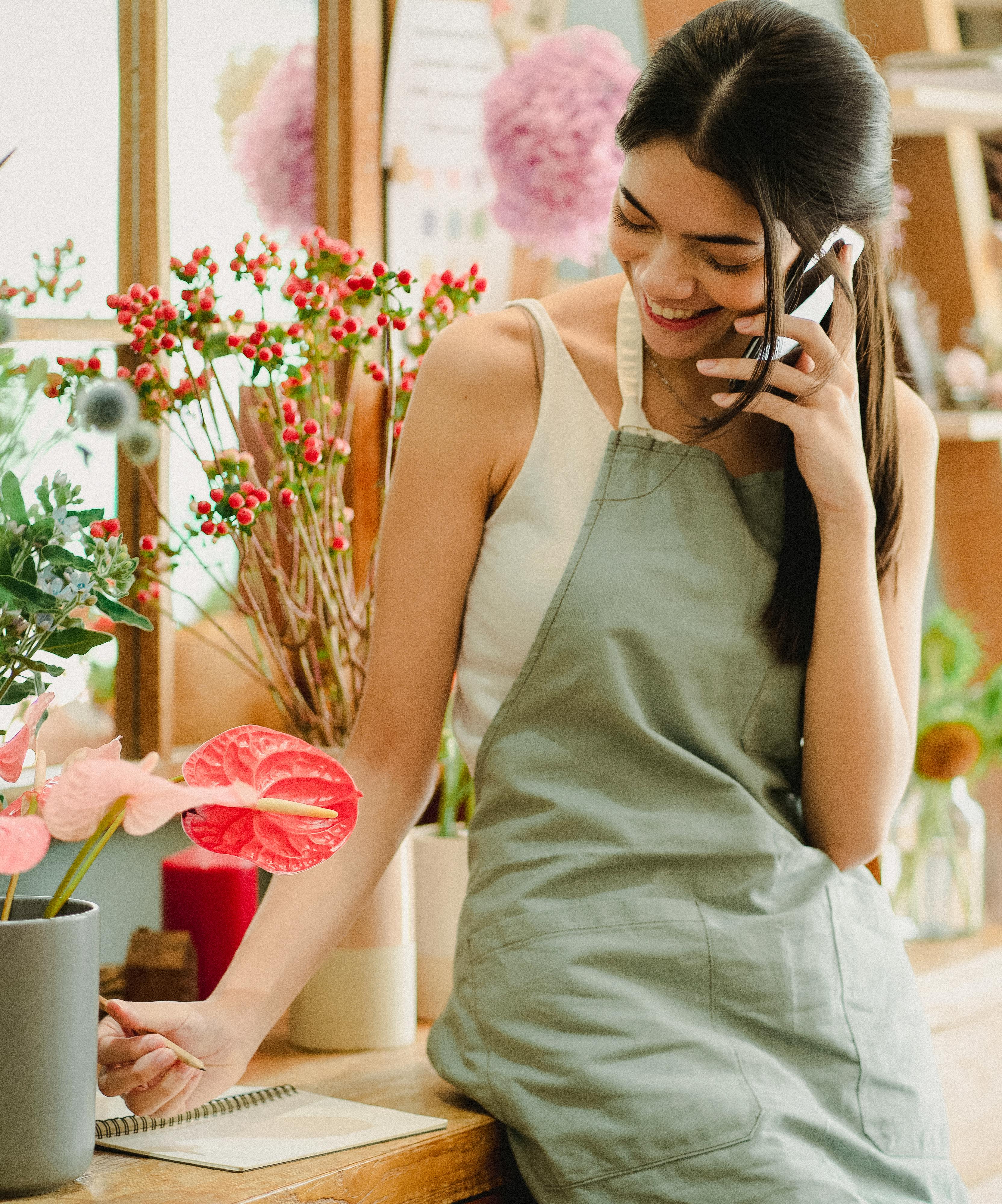 A happy young woman talking to someone on the phone | Source: Pexels