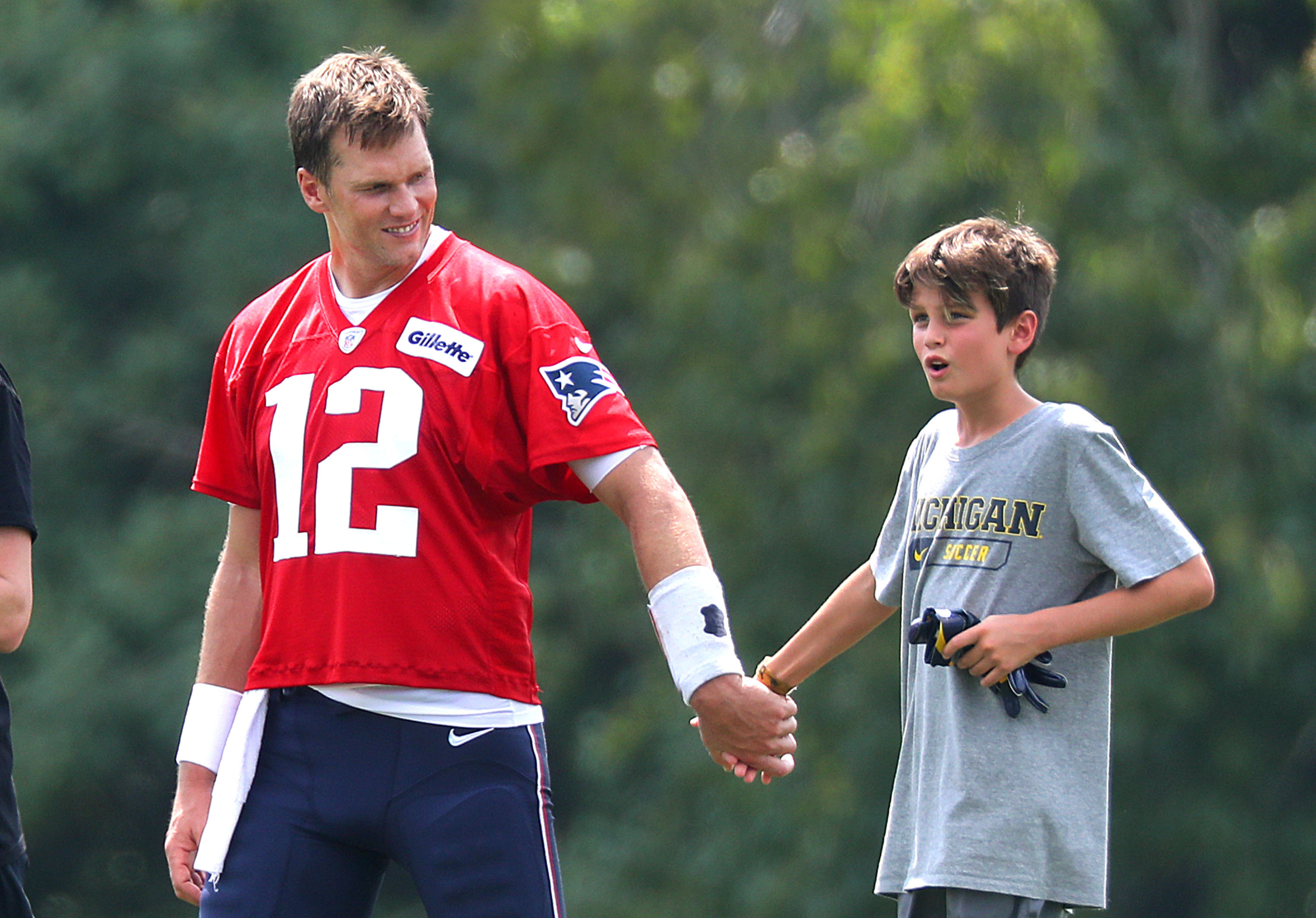 Tom Brady and his son Jack at the Gillette Stadium in Foxborough, MA on August 7, 2018 | Source: Getty Images